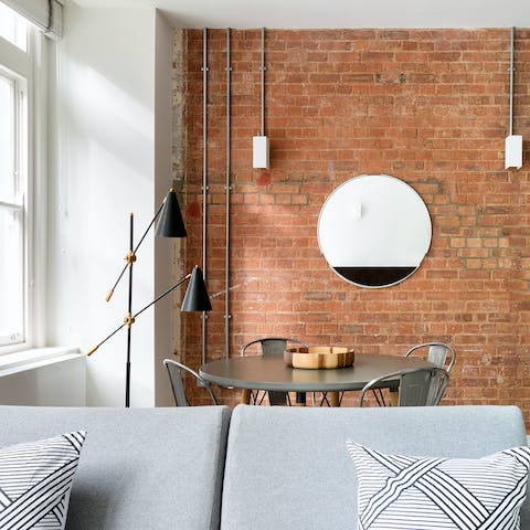 Admire the exposed brickwork in the stylish living space