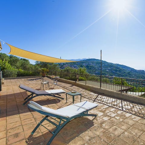 Soak up the Amalfi sunshine on the loungers while gazing at the sea 