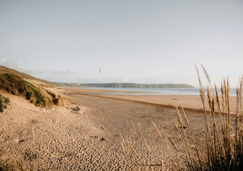 Stroll along the three miles of golden sands at nearby Woolacombe beach