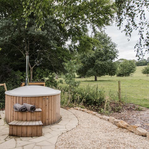 Keep warm in the wood-fired hot tub overlooking the estate
