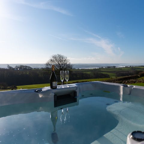 Fall in love with the coastal and countryside views from the hot tub