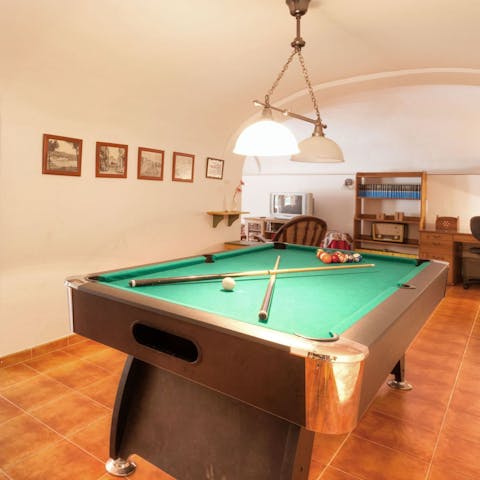 Unwind with a game of billiards after a day in the sun