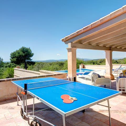 Unleash your competitive side with a game of table tennis in the sun