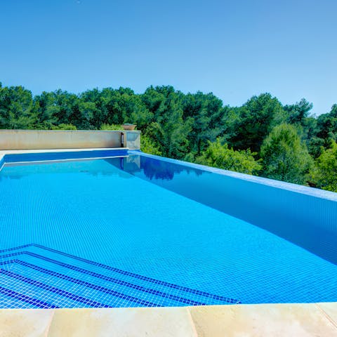 Take in the views of the verdant woodland from the private pool
