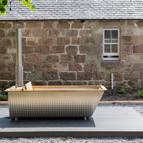 Embrace the natural elements and enjoy a long soak in the wood-fired hot tub