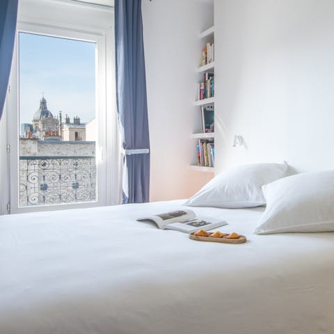 Wake up in the comfortable bedroom to views of Saint-Paul-Saint-Louis Church in the distance