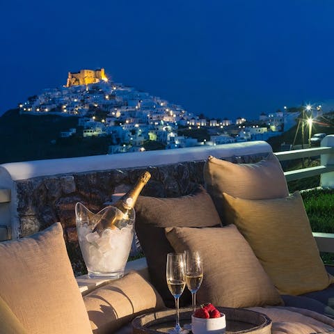 Admire the nearby Greek architecture while indulging in some champagne