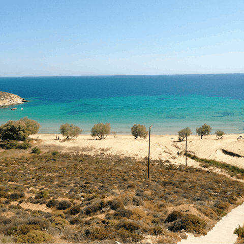 Bathe in the sun at Livadi beach, only a twenty–two–minute walk away