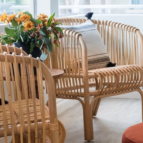 Catch up with friends while tucked into the uniquely crafted cane furniture