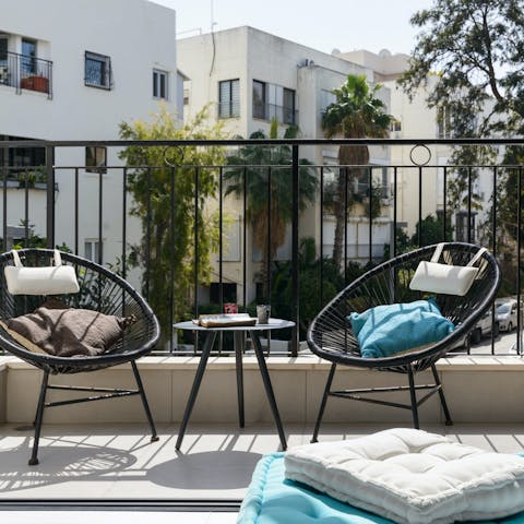 Start your day with a cup of coffee out on your private balcony