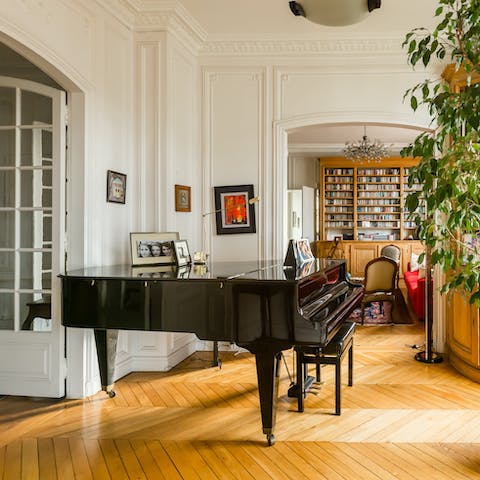 Strike up a tune on the piano in the music room