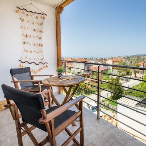 Admire views of the surrounding town and the mountainous backdrop from your balcony