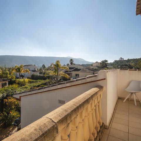 Wake up to spectacular views from the main bedroom's private balcony