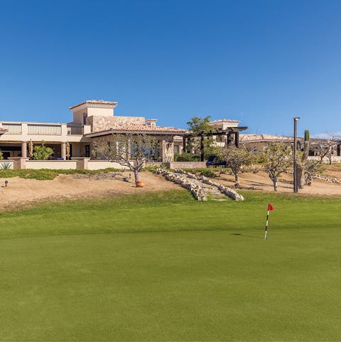 Practise your swing at the golf course next to the villa