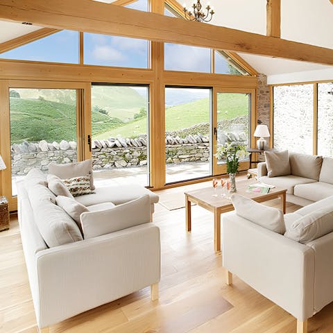 Admire the rolling countryside from the wall of glass