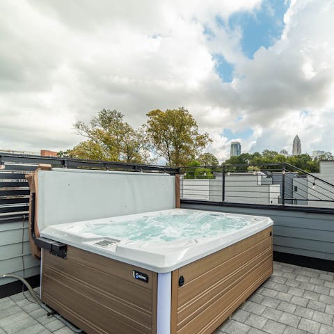 Relax in the hot tub with views across Charlotte