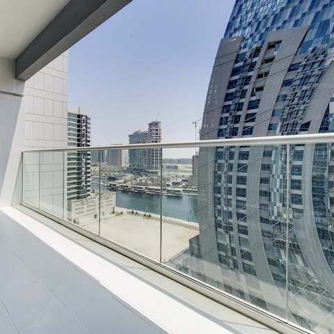 Enjoy the views of Dubai Canal from the balcony