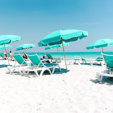 Sink your toes in the sand at Miami Beach, a three-minute walk away