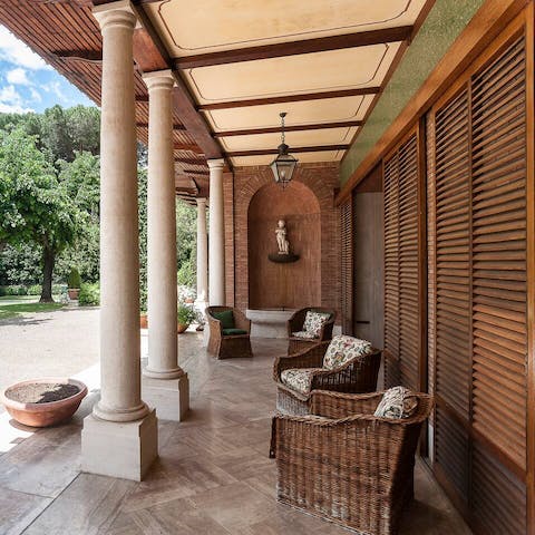 Admire the manicured lawn from the wicker chairs on the front terrace