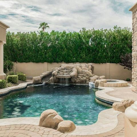 Unwind in the pool under the waterfall