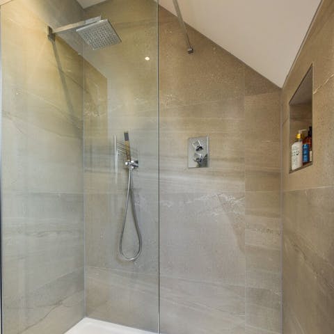 Pamper yourself in the ample walk-in rainfall shower 