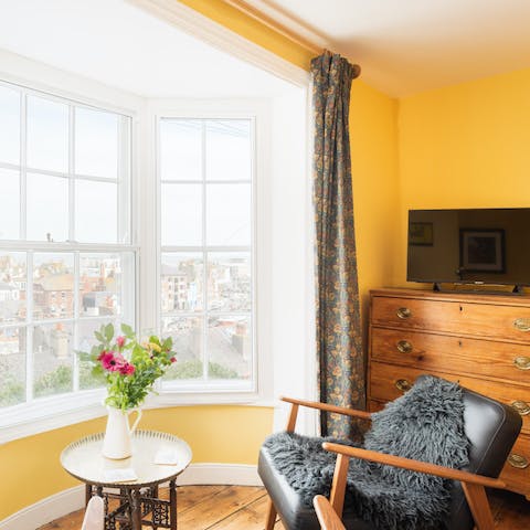 Catch up on your current read in this snug armchair, overlooking the harbour