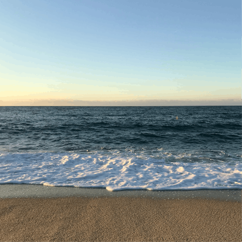 Sunbathe on the sand or splash in the sea at nearby El Faro beach