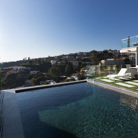 Take an early morning dip in the swimming pool and look out to the local Hollywood Hills