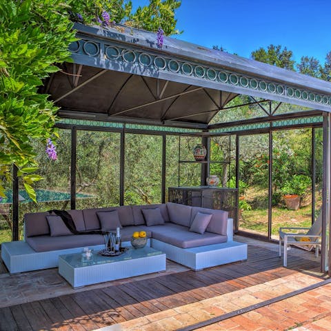 Relax in the delightful gazebo in the gardens