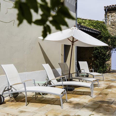 Soak up the Mediterranean sunshine on the patio loungers 