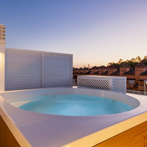 Relax with a glass of sangria in the private hot tub