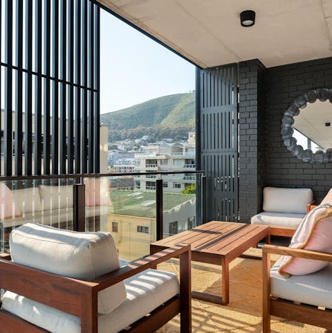 Take in the city and mountain vistas from the private balcony