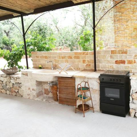 Prepare an Italian array of dishes in the outdoor kitchen