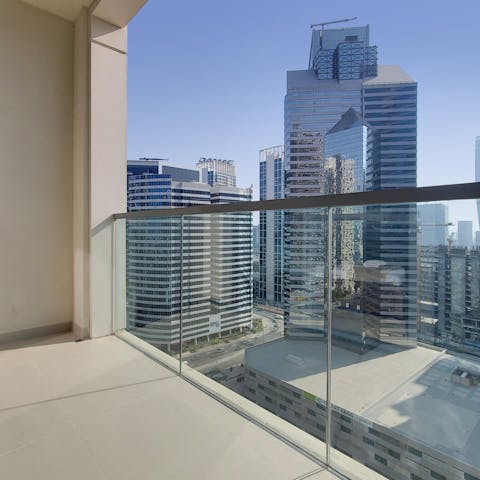 Soak in the stunning views of the cityscape from the modern balcony