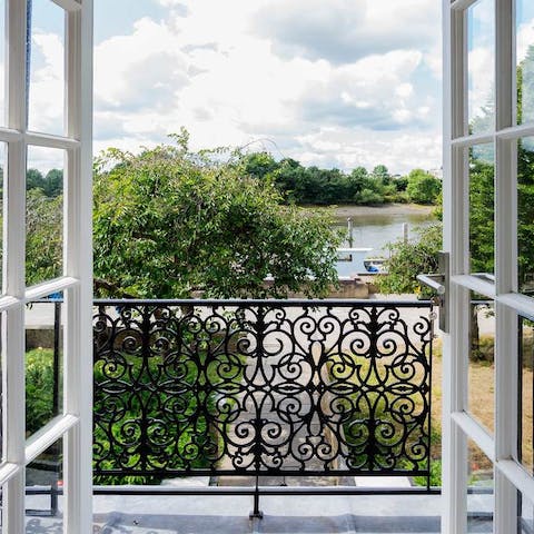 Step out onto the first-floor balcony and look out over peaceful river views