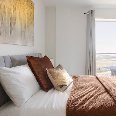 Wake up to coastal vistas from the elegant bedrooms