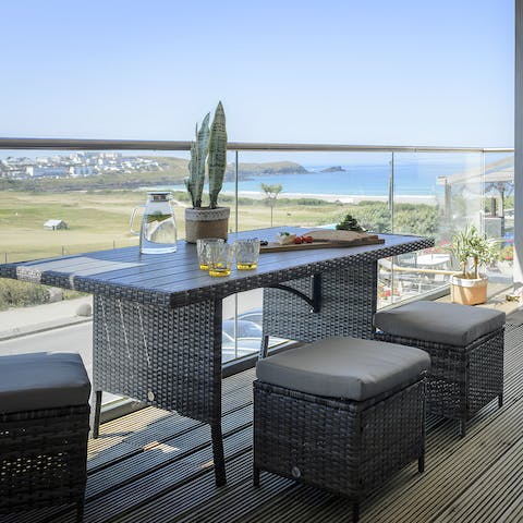 Savour sundowners and sea views from the private balcony