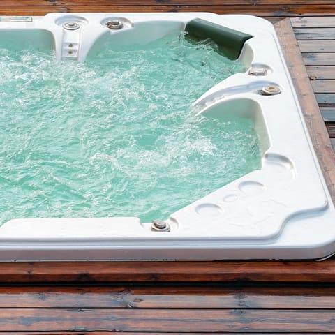 Soak in the outdoor hot tub after spending a day at the beach