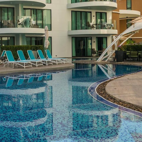 Take a dip in the communal pool or relax on the sun lounger, cool drink in hand 