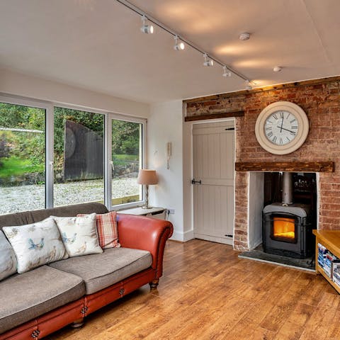 Snuggle up by the wood burner after a day exploring West Devon