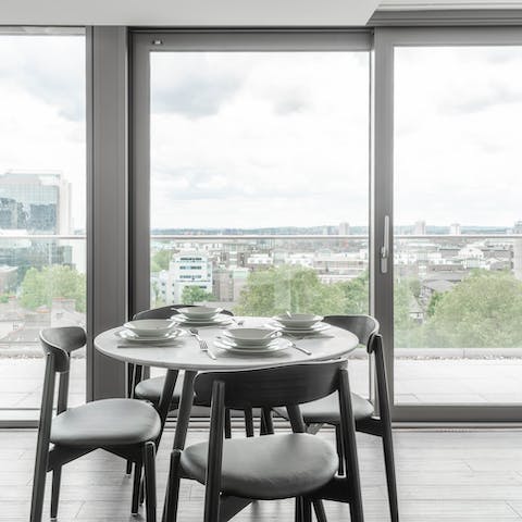 Step out onto the private balcony and take in the expansive city views