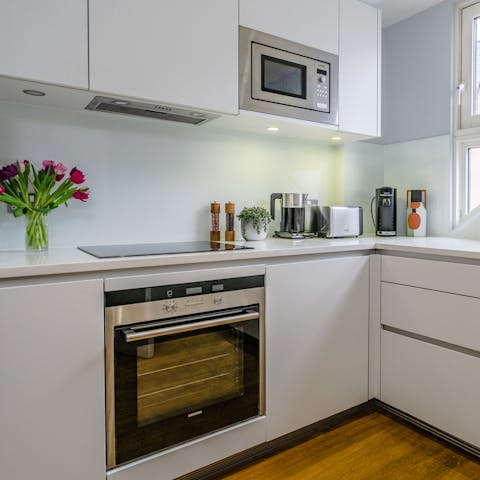 Fire up the coffee machine in the sleek, modern kitchen