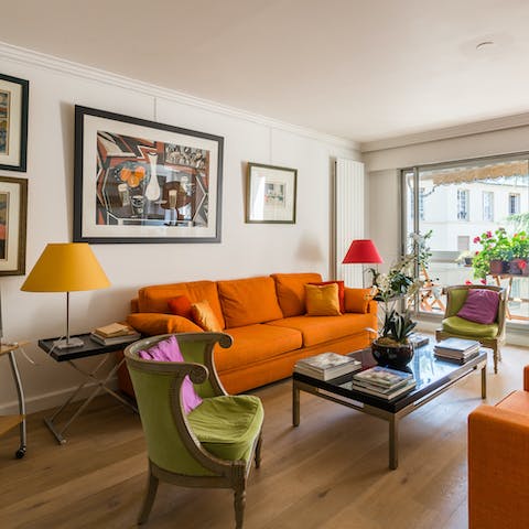 Stretch out in the light-filled living room after a day of exploring Paris' sights