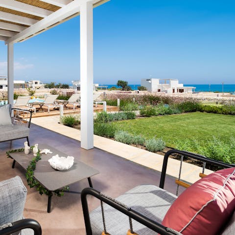 Find your favourite spot on the terrace to watch the ocean shimmer in the sun