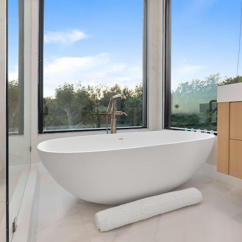 Soak your cares away in the modern freestanding tub