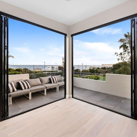 Catch glimpses of the Pacific Ocean from the main bedroom's balcony