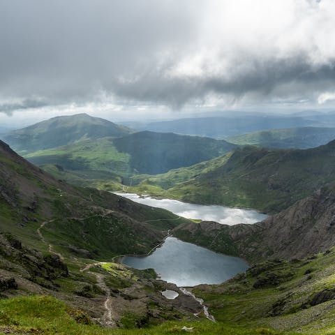 Revel in the sense of accomplishment that comes with hiking up Snowdon, which is just a twenty-minute drive away