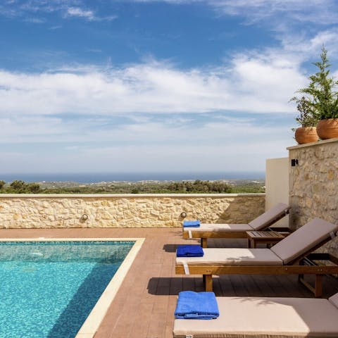 Stretch out poolside with panoramic sea views