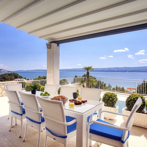 Feast on Croatian cuisine and sea views on the covered terrace