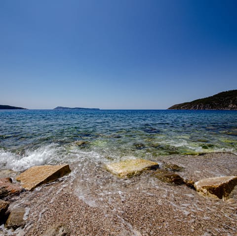 Slip on your sandals and stroll down to Vavlje Beach